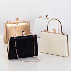 A small clutch bag in gold color - Handbags