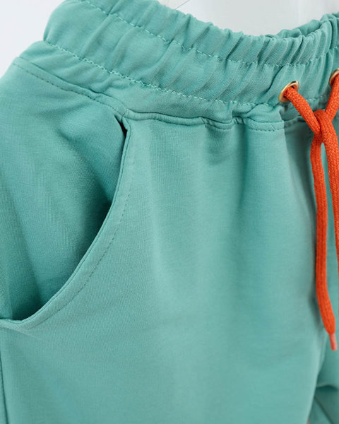 Women's green sweatpants with a colored patch - Clothing