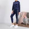 Women's navy blue tracksuit with stripes - Clothing